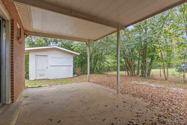 view of patio / terrace featuring a storage unit