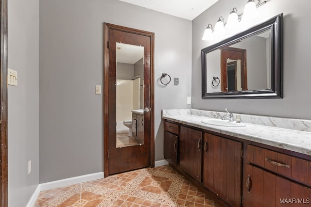 bathroom with vanity and toilet