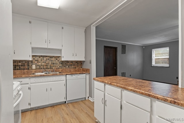 kitchen featuring tasteful backsplash, ornamental molding, dishwasher, range, and white cabinetry