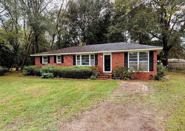 ranch-style house with a front lawn