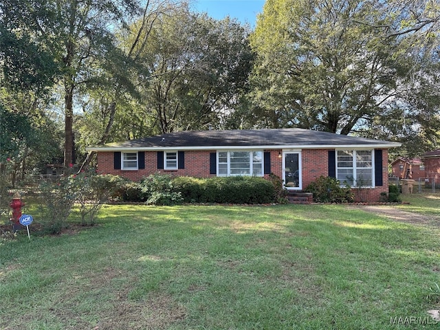 single story home featuring a front yard