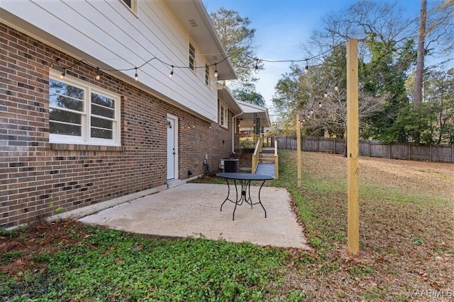 view of yard with cooling unit and a patio area