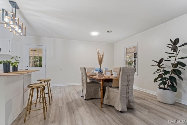 dining room with light hardwood / wood-style flooring