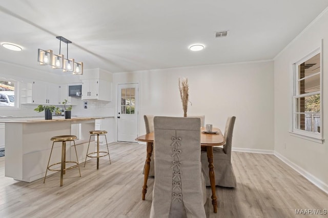 dining room featuring light hardwood / wood-style floors