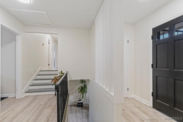 entryway with light hardwood / wood-style floors