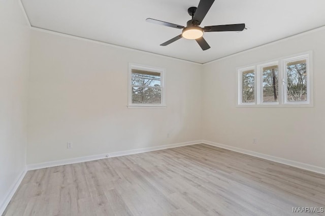 empty room featuring ornamental molding, ceiling fan, and light hardwood / wood-style flooring