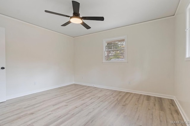 empty room featuring crown molding, ceiling fan, and light wood-type flooring