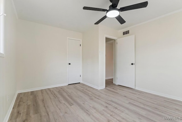 spare room featuring light hardwood / wood-style floors