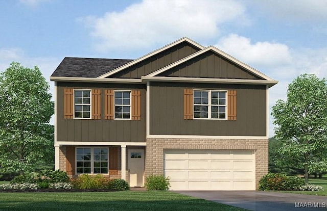 view of front of home with a garage and a front lawn