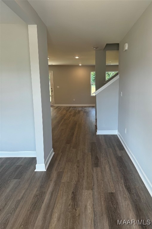 interior space with dark hardwood / wood-style flooring