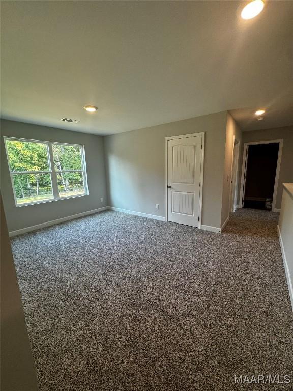 spare room featuring carpet flooring