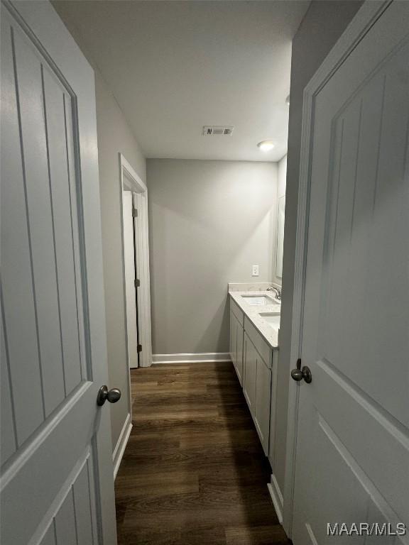 bathroom featuring hardwood / wood-style flooring and vanity