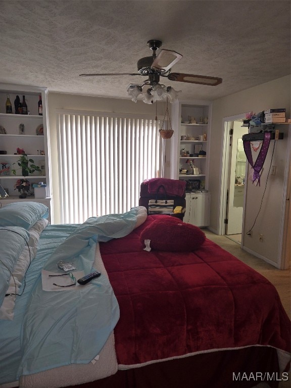 bedroom featuring a textured ceiling and ceiling fan