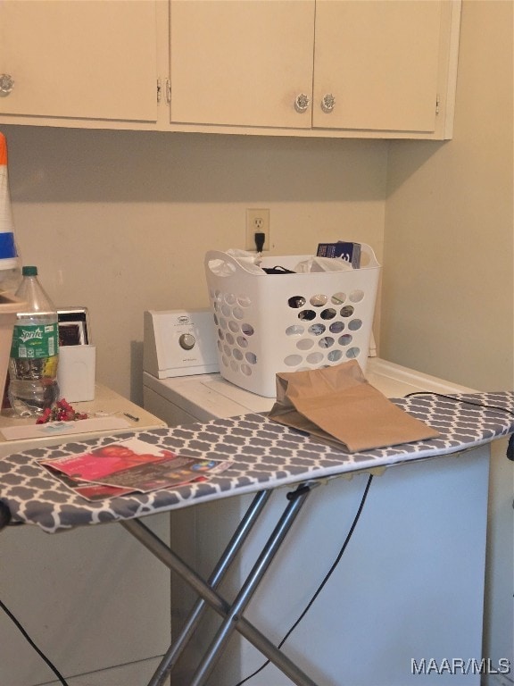 laundry room featuring cabinets