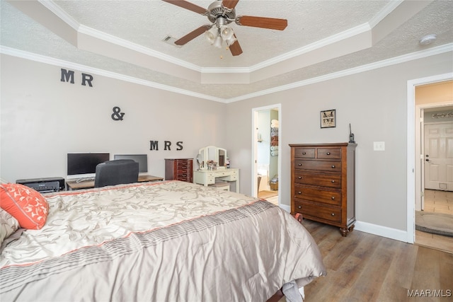 bedroom with ensuite bathroom, ceiling fan, and crown molding