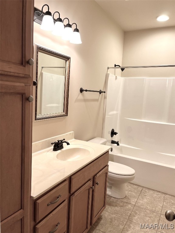 full bathroom with toilet, washtub / shower combination, vanity, and tile patterned floors