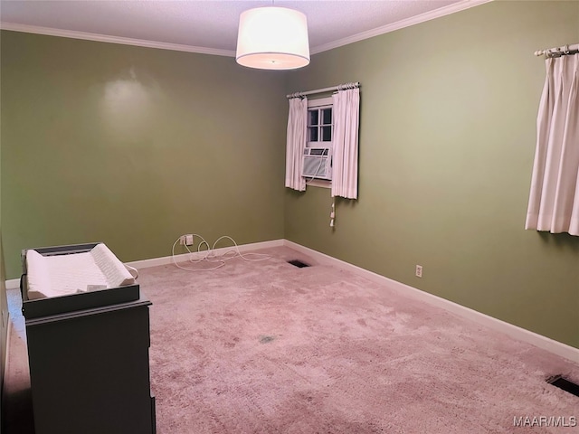 carpeted spare room with ornamental molding