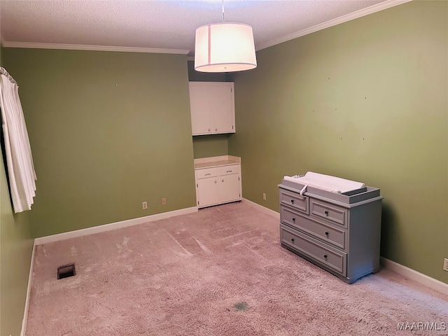 unfurnished bedroom with crown molding, light colored carpet, and a textured ceiling