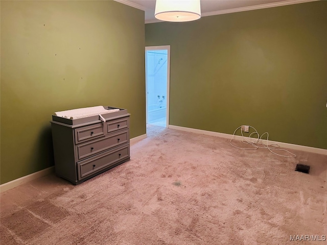 spare room with light colored carpet and ornamental molding