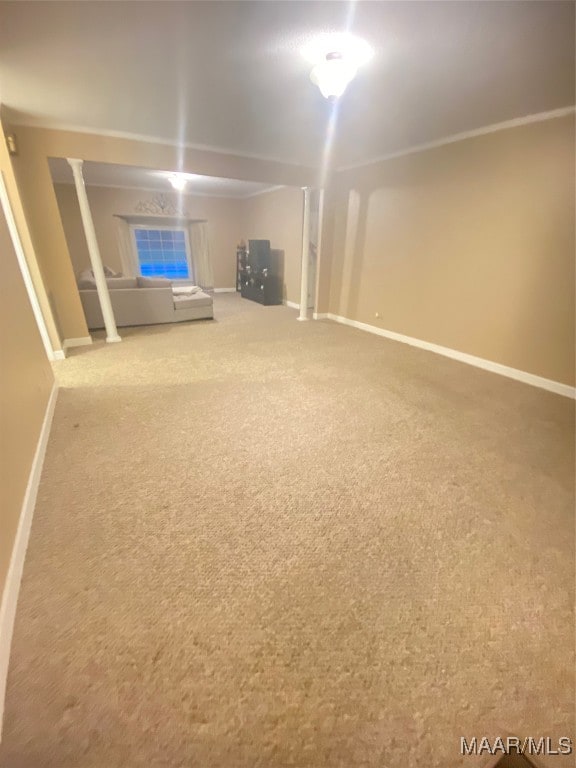 basement featuring carpet and ornamental molding