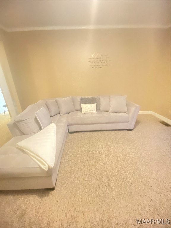 carpeted living room featuring ornamental molding