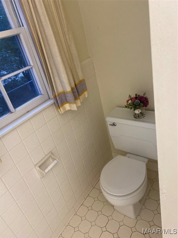 bathroom featuring tile patterned floors and toilet