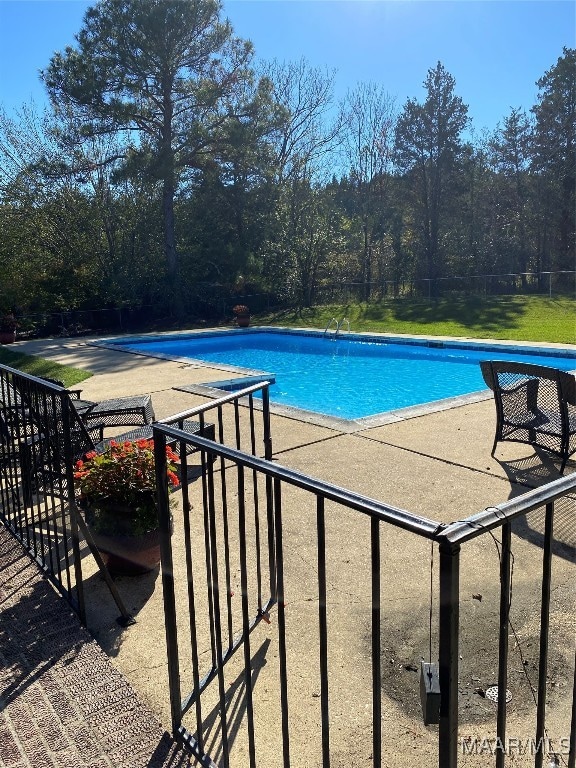 view of pool with a patio area