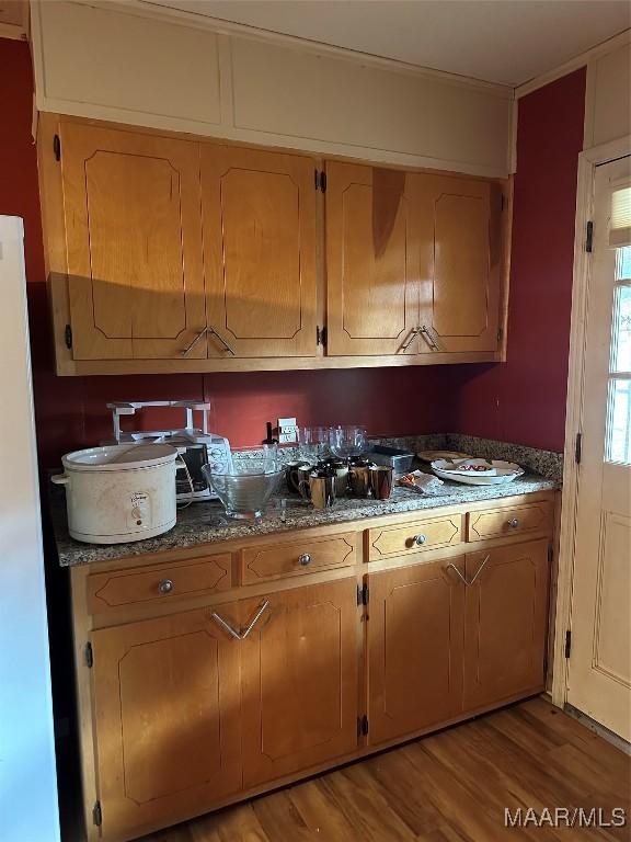 225 Merrimac Dr, Selma, AL 36701 - kitchen with light wood-style flooring, freestanding refrigerator, and dark countertops