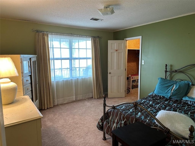 225 Merrimac Dr, Selma, AL 36701 - bedroom with crown molding, light colored carpet, and a textured ceiling
