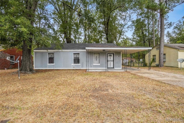 view of front of home featuring a carport and covered porch