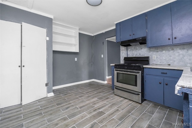 kitchen with ornamental molding, blue cabinets, gas range, and dark hardwood / wood-style floors