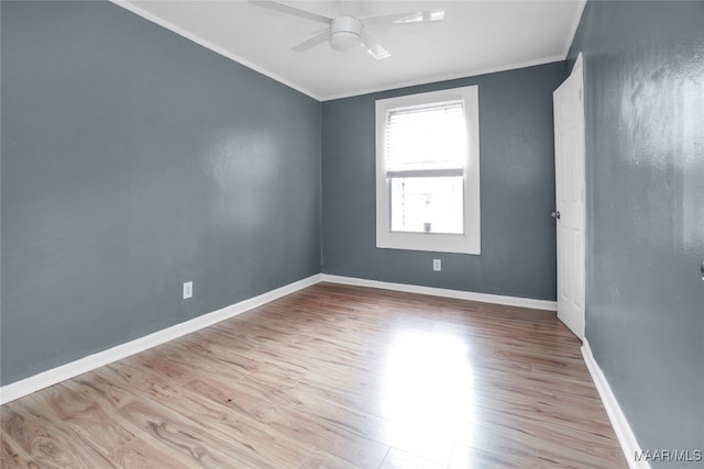 unfurnished room with light hardwood / wood-style floors, ceiling fan, and crown molding