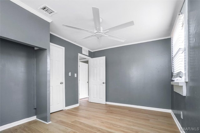 170 W S Blvd, Montgomery, AL 36105 - unfurnished bedroom with wood finished floors, crown molding, baseboards, ceiling fan, and a closet