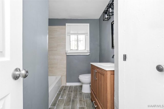 170 W S Blvd, Montgomery, AL 36105 - full bath with vanity, toilet, a tub, wood tiled floors, and baseboards