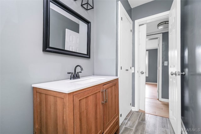 bathroom with vanity and hardwood / wood-style floors