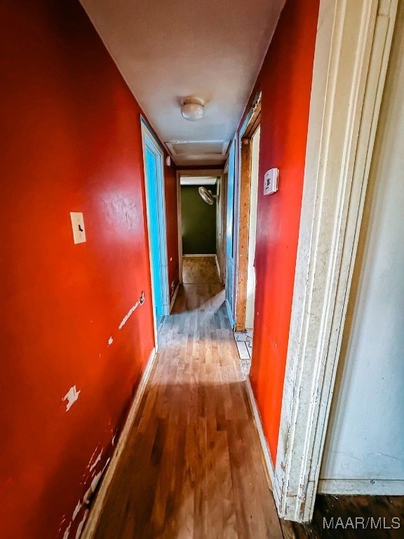 corridor featuring hardwood / wood-style flooring