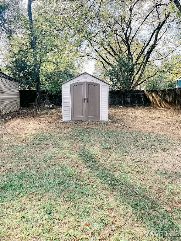 view of outdoor structure featuring a lawn