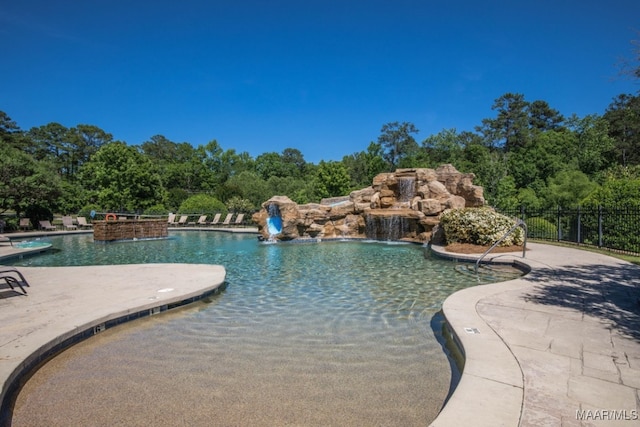 view of pool featuring pool water feature