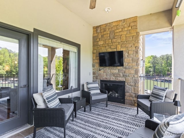 view of patio with an outdoor stone fireplace