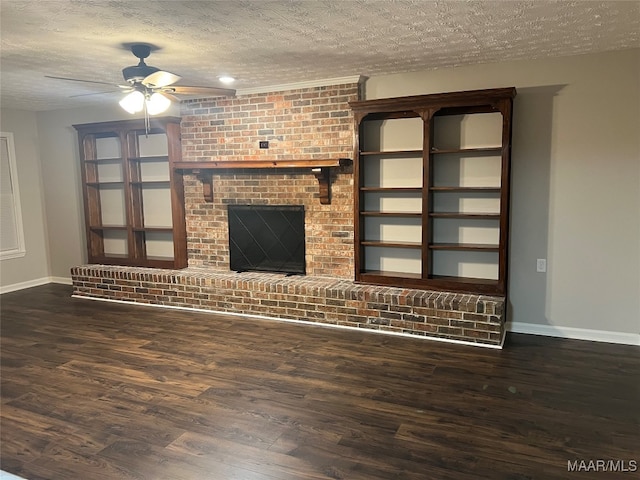 unfurnished living room with ceiling fan, a textured ceiling, dark hardwood / wood-style floors, and a fireplace