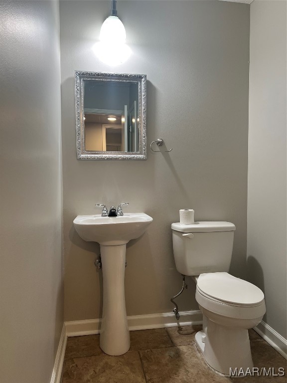 bathroom with toilet and sink