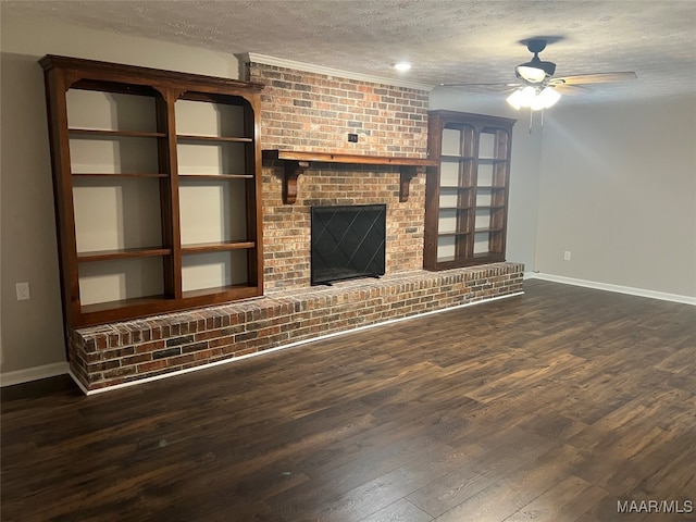 unfurnished living room featuring dark wood-type flooring, a textured ceiling, ceiling fan, and a fireplace