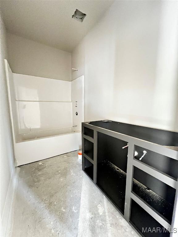 bathroom featuring concrete flooring