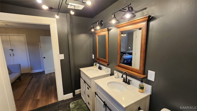 bathroom with hardwood / wood-style floors and vanity