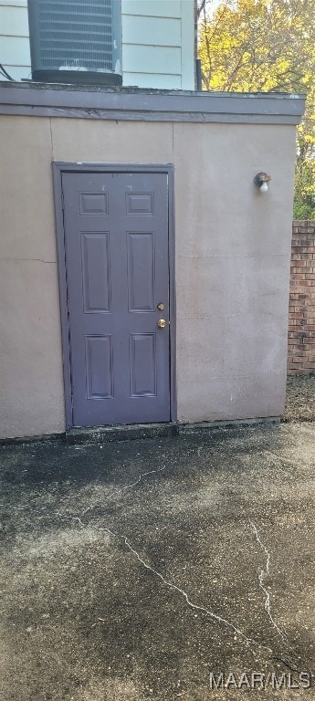 entrance to property with central AC unit