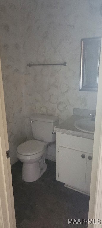 bathroom with vanity and toilet