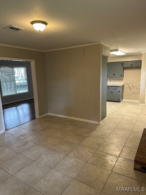 unfurnished room with ornamental molding