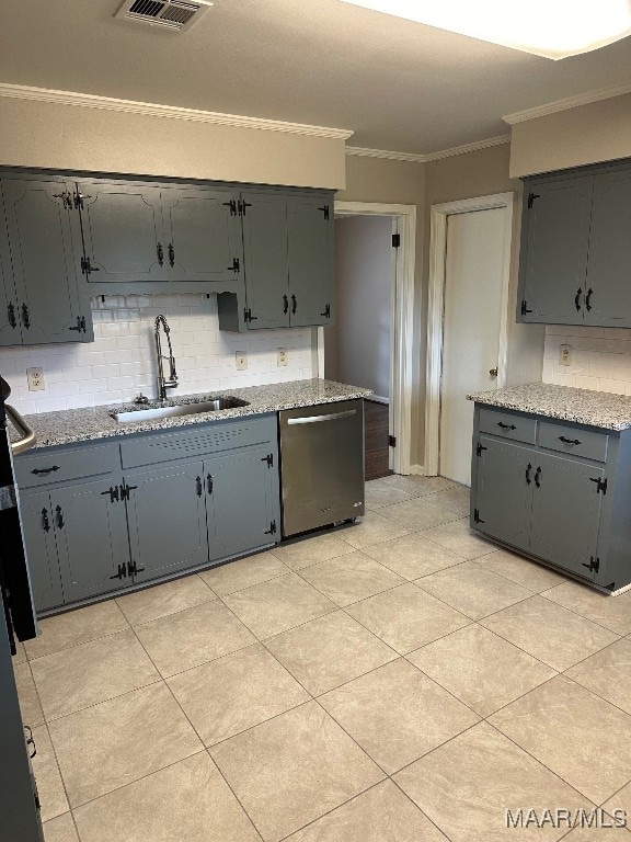 kitchen featuring ornamental molding, gray cabinets, decorative backsplash, sink, and dishwasher