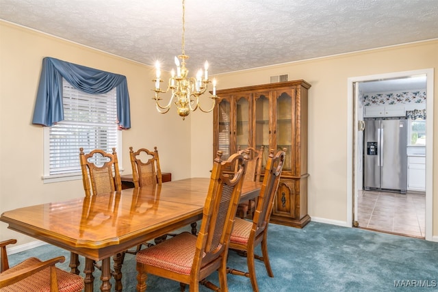 carpeted dining space featuring a wealth of natural light, a textured ceiling, and crown molding