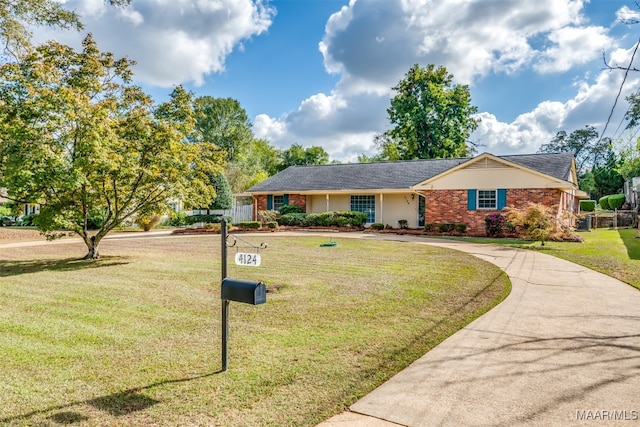 ranch-style house with a front lawn